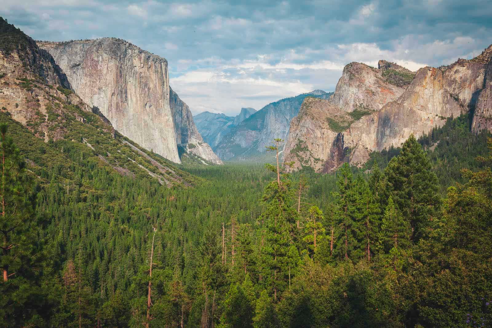 The iconic granite faces of El Capitan and Half Dome as seen from Tunnel View in Yosemite National Park.