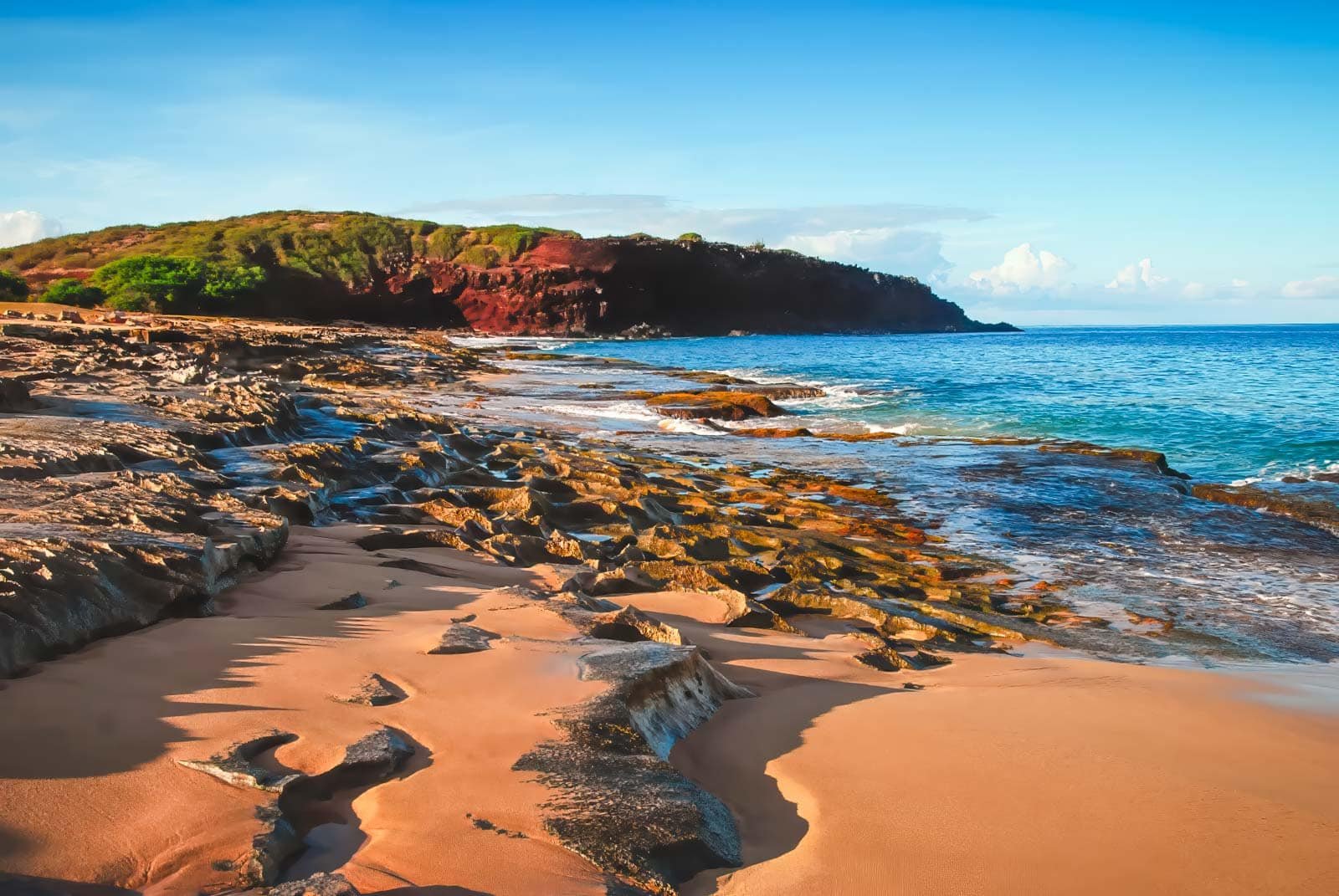 The empty stretch of golden sand at Kepuhi Beach on the island of Molokai, Hawaii