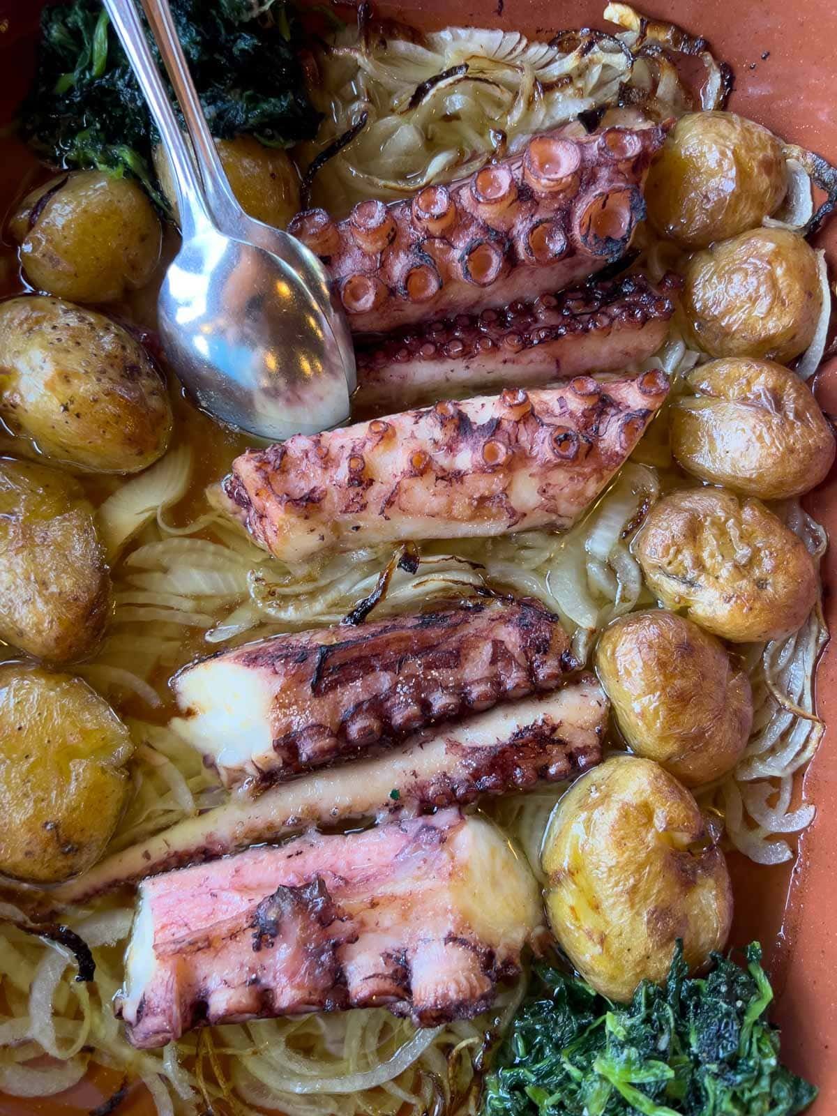 Tender roasted octopus, or Polvo à Lagareiro, served with potatoes in a garlic and olive oil sauce.