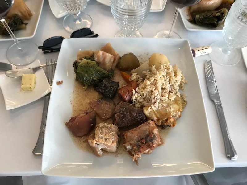 A hearty platter of Cozido à Portuguesa, a traditional boiled stew with various meats and vegetables.
